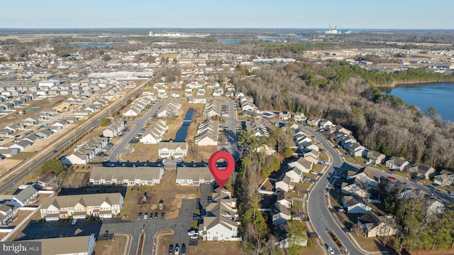 birds eye view of property featuring a residential view and a water view