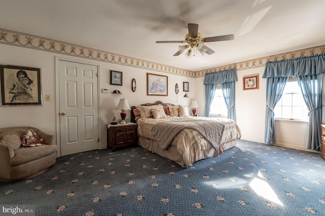 bedroom featuring ceiling fan and carpet flooring