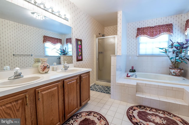 bathroom with plus walk in shower, tile patterned floors, and vanity