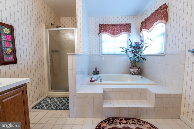 bathroom with tile patterned flooring, vanity, and independent shower and bath