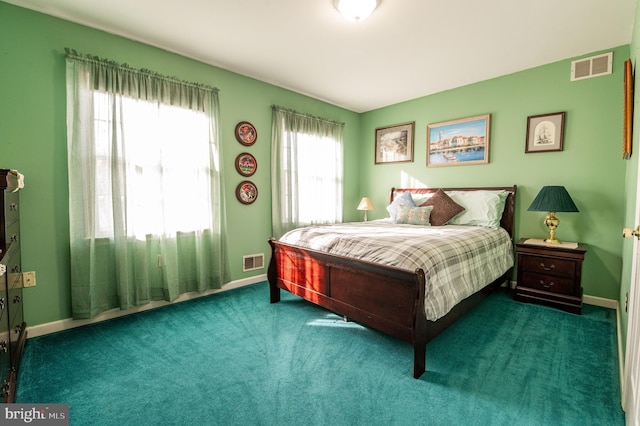 bedroom featuring dark carpet