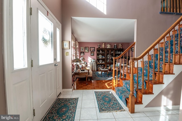 foyer entrance featuring light tile patterned flooring