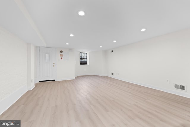 spare room featuring light hardwood / wood-style flooring