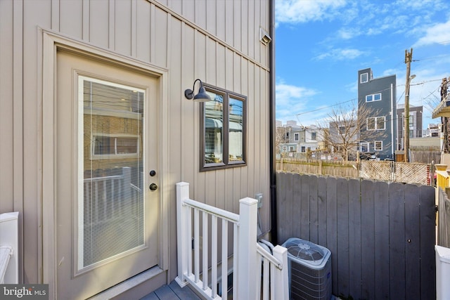 doorway to property with central AC unit