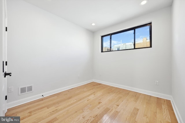 spare room featuring light wood-type flooring