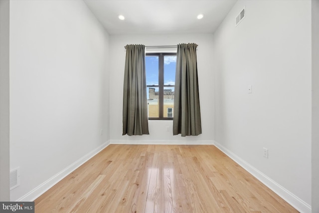 spare room featuring light wood-type flooring