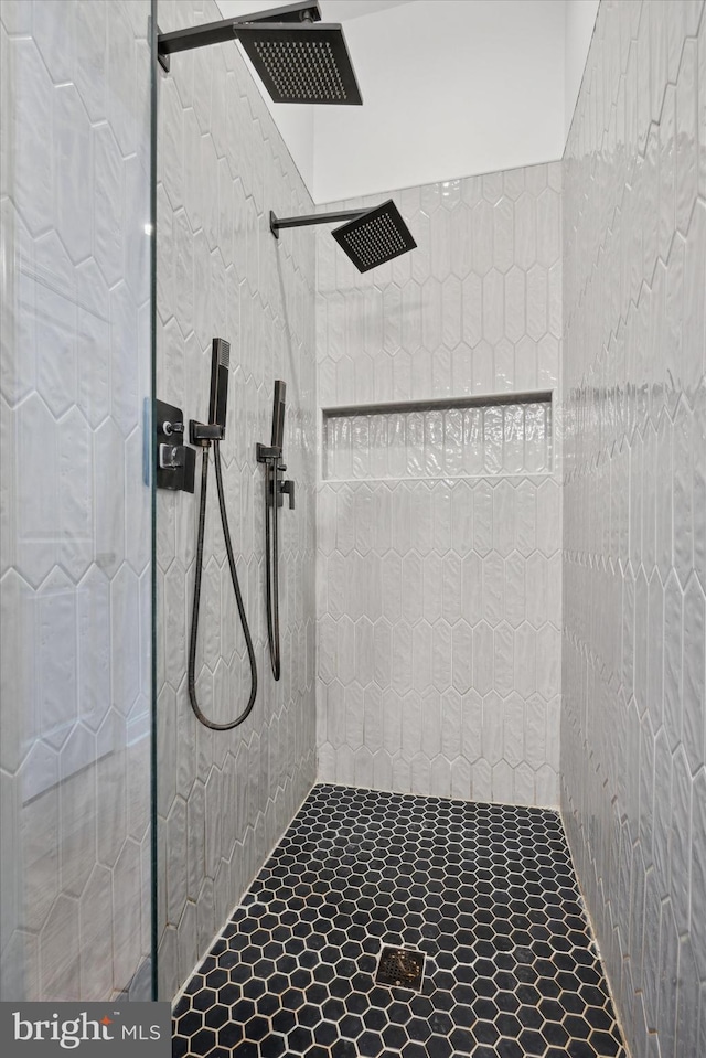 bathroom with a tile shower