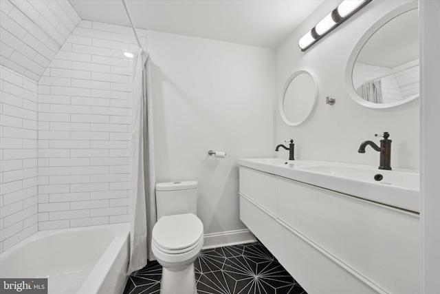 full bathroom with vanity, tile patterned flooring, tiled shower / bath, and toilet