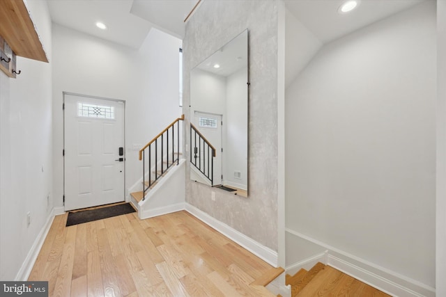 foyer entrance with light hardwood / wood-style floors