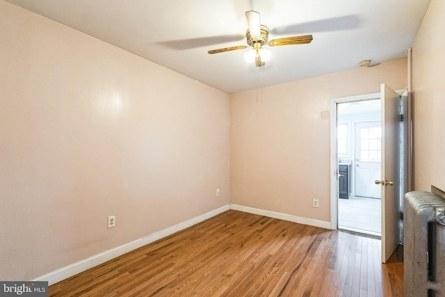 unfurnished room with ceiling fan and light hardwood / wood-style floors