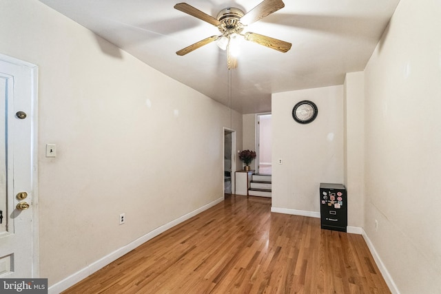 unfurnished room featuring ceiling fan and light wood-type flooring