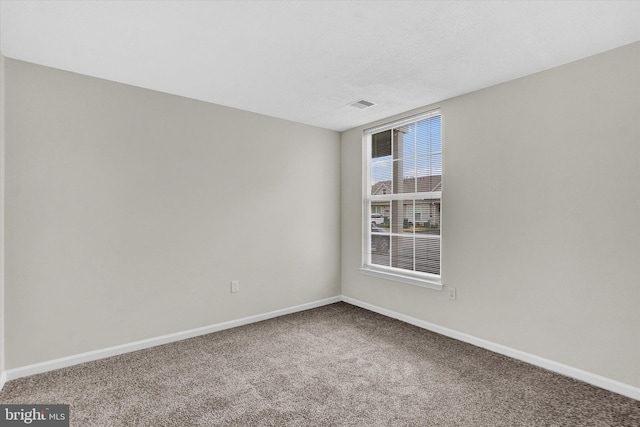 empty room featuring carpet flooring