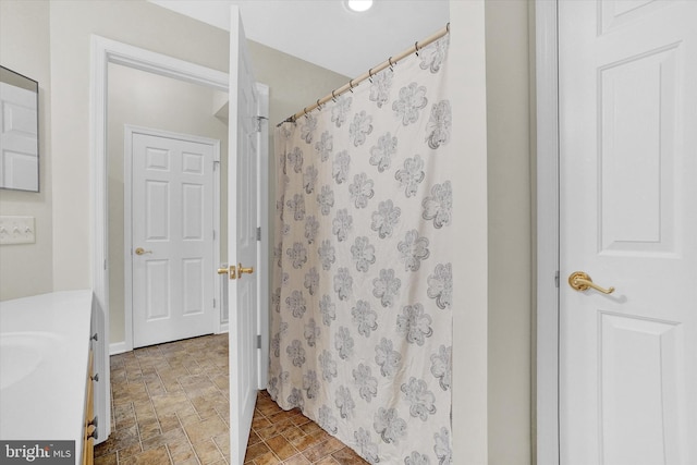 bathroom featuring vanity and a shower with curtain