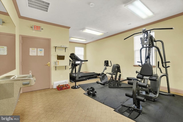 workout area with ornamental molding