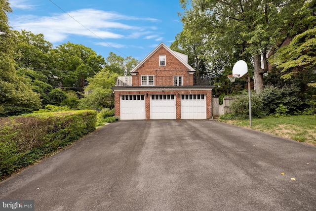 view of side of home featuring a garage and an outdoor structure