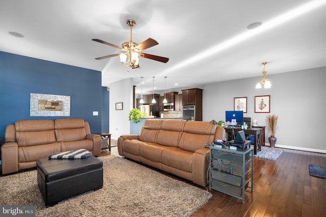 living room featuring ceiling fan and dark hardwood / wood-style flooring