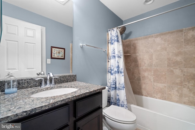 full bathroom featuring vanity, shower / bath combination with curtain, and toilet