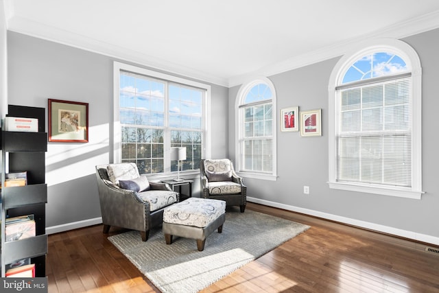 sitting room featuring hardwood / wood-style flooring and ornamental molding