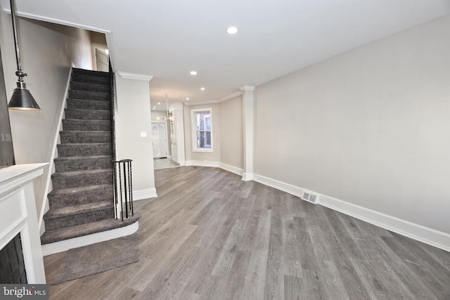 interior space featuring recessed lighting, visible vents, stairway, wood finished floors, and baseboards