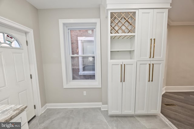 details with baseboards and wood finished floors