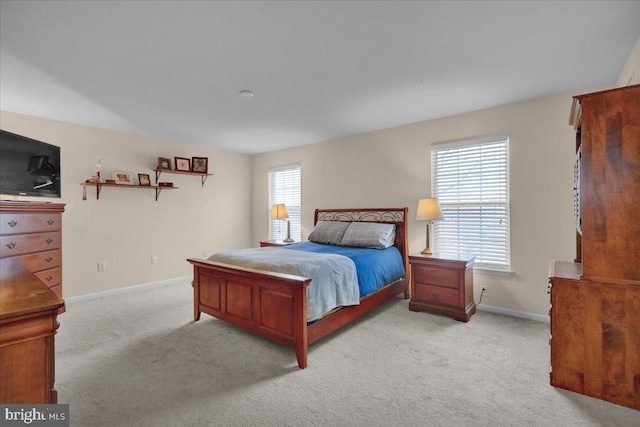 bedroom with light colored carpet