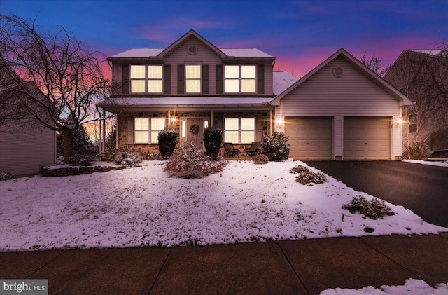 front of property with a garage