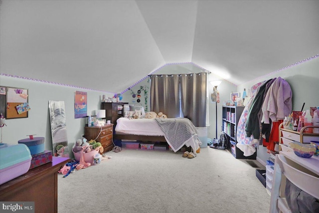 bedroom with vaulted ceiling and carpet