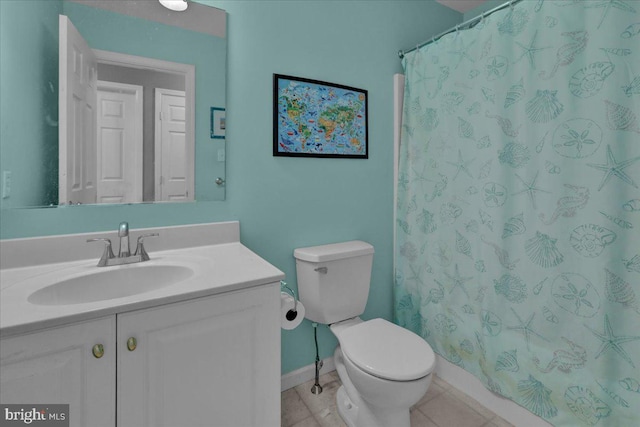 bathroom with tile patterned flooring, vanity, a shower with curtain, and toilet