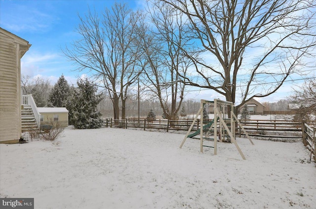 view of yard layered in snow