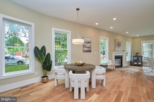 dining area with light hardwood / wood-style floors