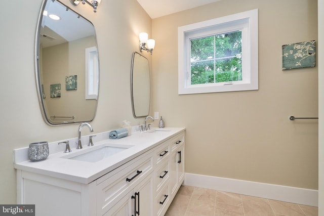 bathroom with tile patterned flooring and vanity