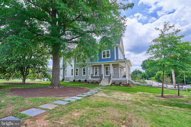 view of front of house featuring a porch and a front yard