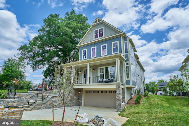 view of front of property featuring a garage and a front yard