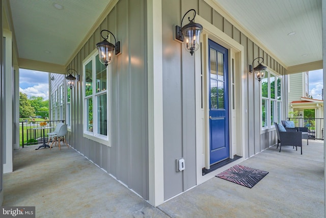 view of exterior entry with a porch