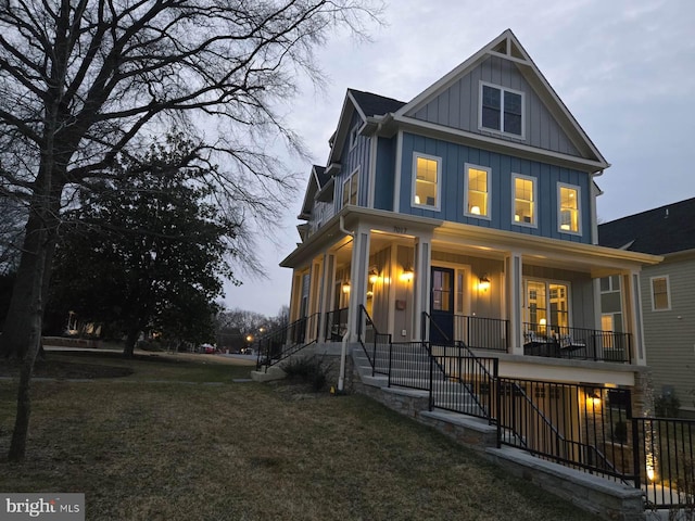 view of front of house with a porch and a front yard