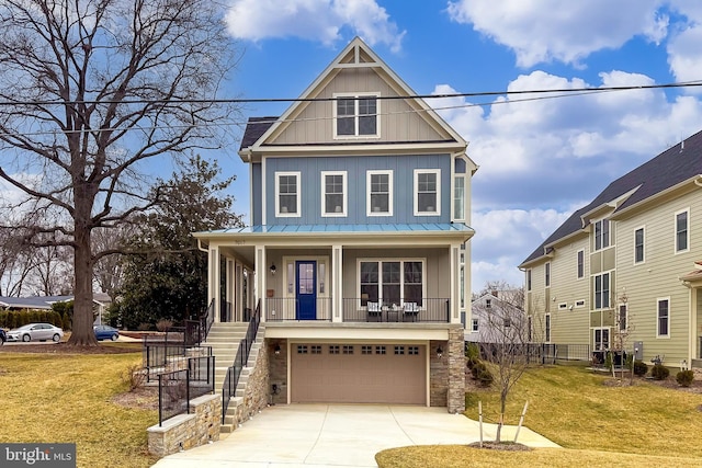 view of front of property with a porch, a garage, and a front lawn