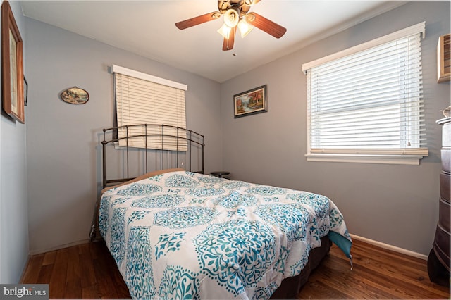 bedroom featuring ceiling fan and dark hardwood / wood-style flooring