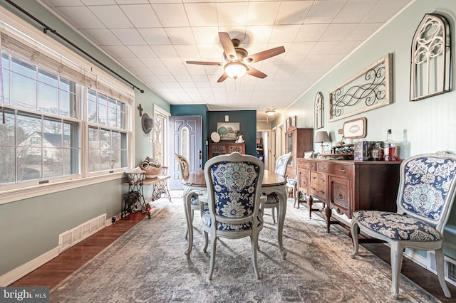 dining area with hardwood / wood-style flooring and ceiling fan