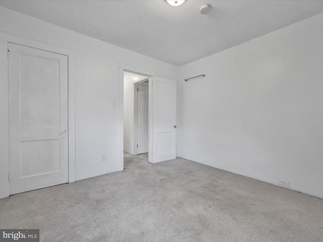 unfurnished bedroom with light carpet