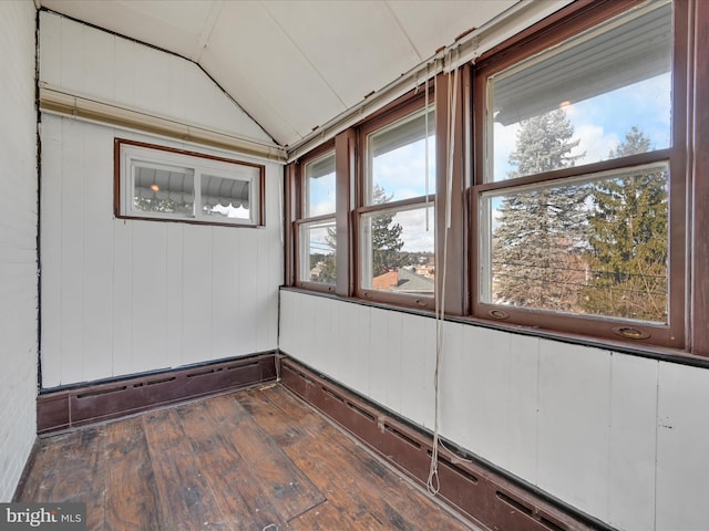 unfurnished sunroom featuring vaulted ceiling