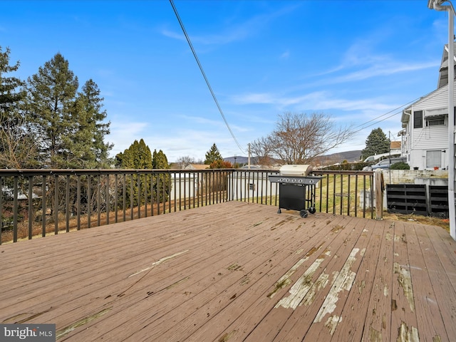 wooden terrace with area for grilling