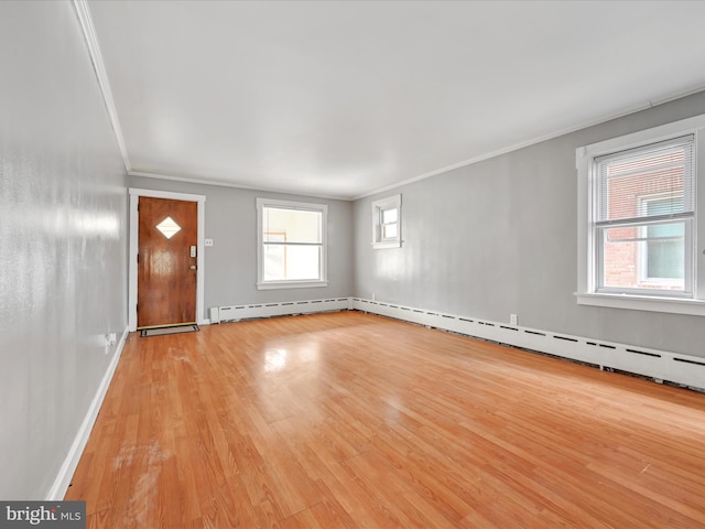 entrance foyer with ornamental molding and light wood-type flooring