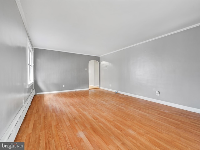 unfurnished room with crown molding, light hardwood / wood-style floors, and baseboard heating