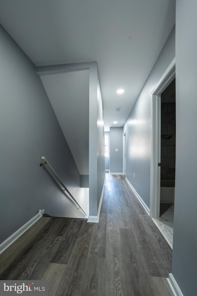 corridor with dark hardwood / wood-style floors