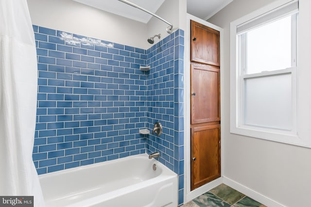 bathroom with shower / bath combo with shower curtain