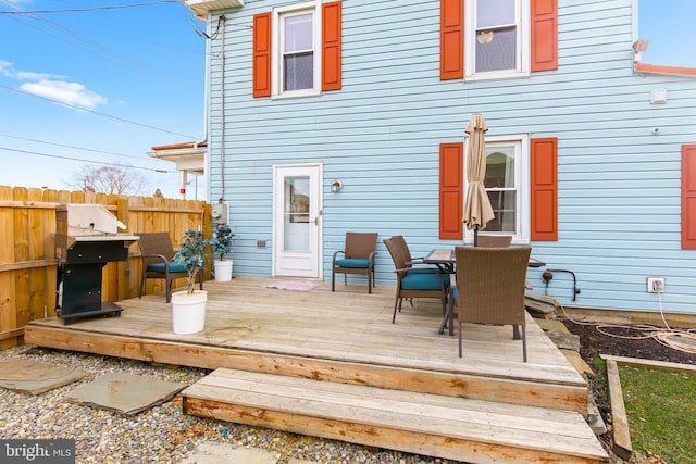 back of house featuring a wooden deck