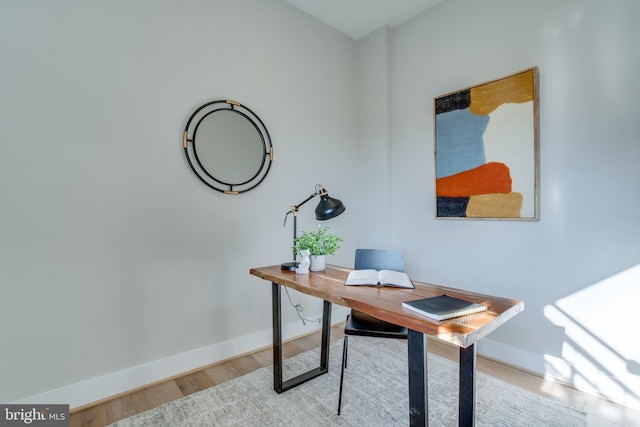 office area with light hardwood / wood-style floors