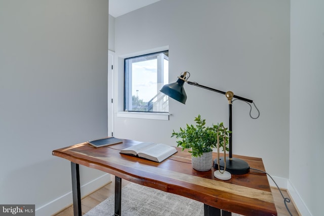 office with light hardwood / wood-style flooring