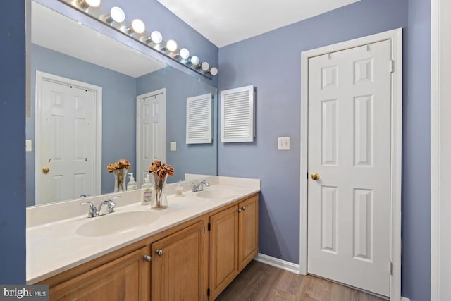 bathroom with vanity and hardwood / wood-style floors