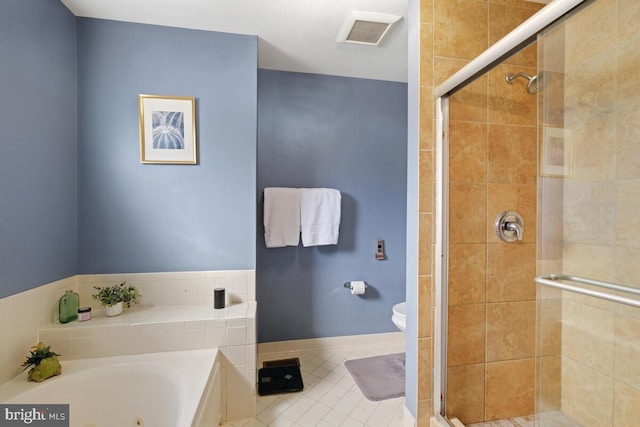 bathroom featuring independent shower and bath, tile patterned floors, and toilet